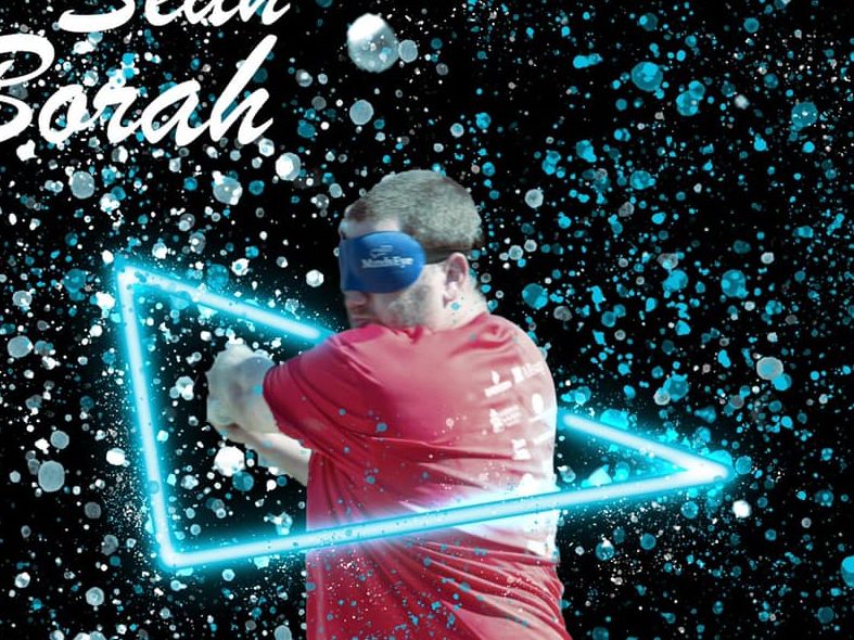 Sean Borah in a Neon Triange