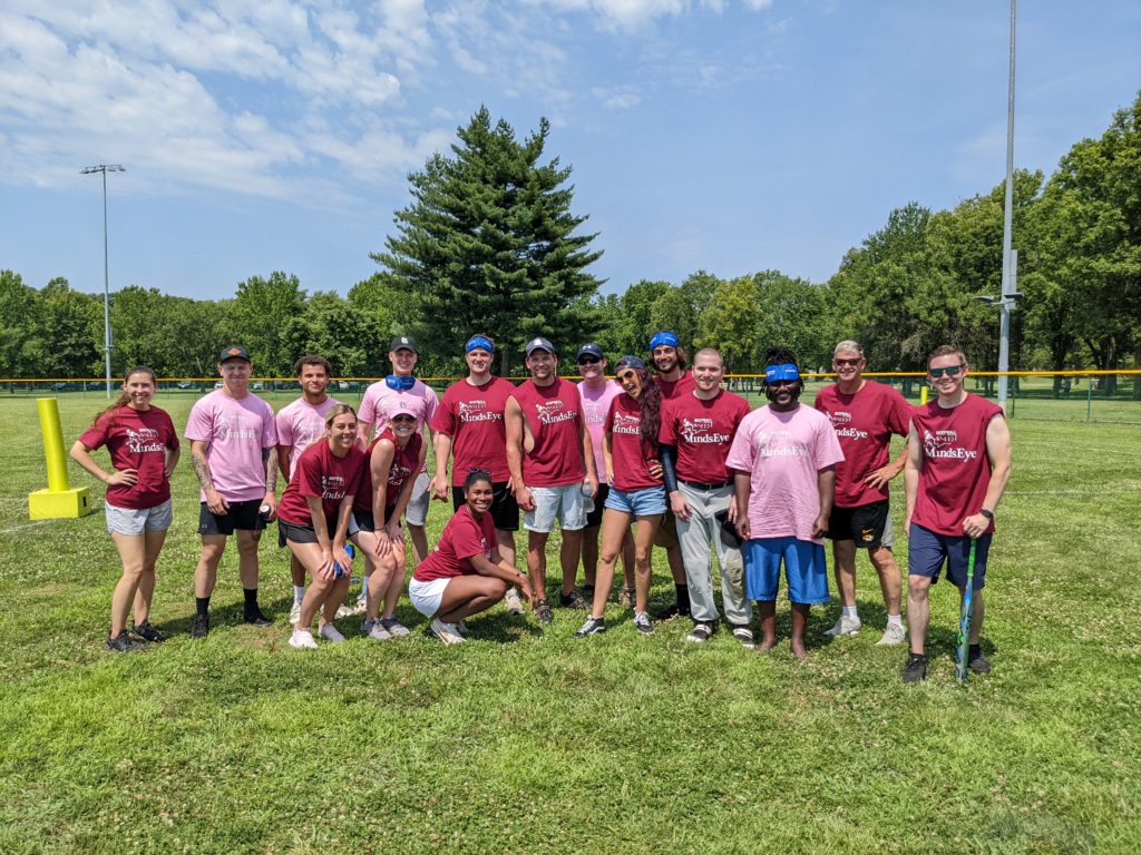Photo of the Hannigan and Luxe Life BeepBall teams, some in red and some in pink jerseys