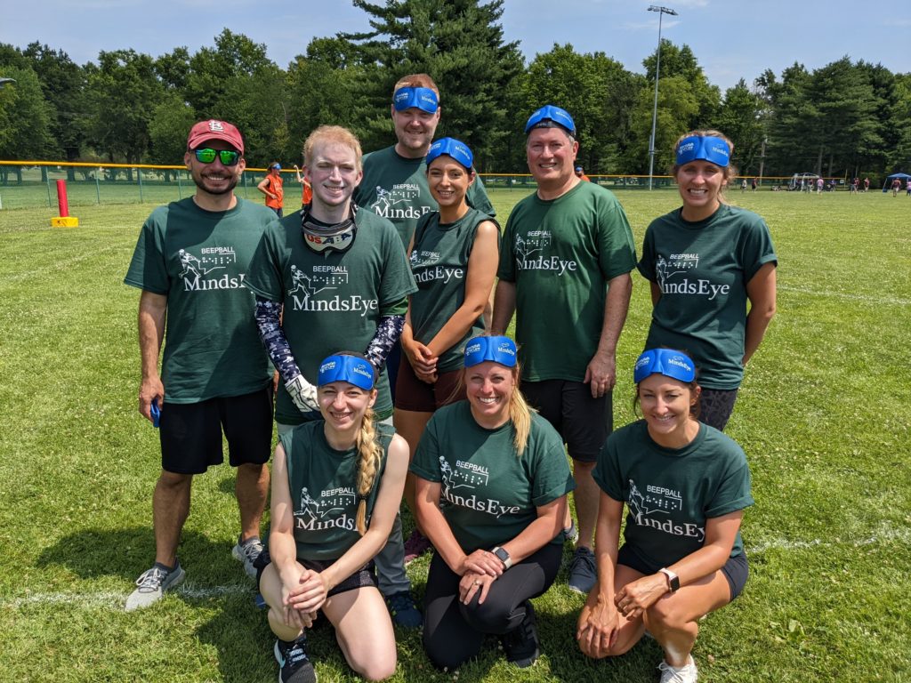 Photo of WASHU Visionaries BeepBall Team, in matching dark green jerseys