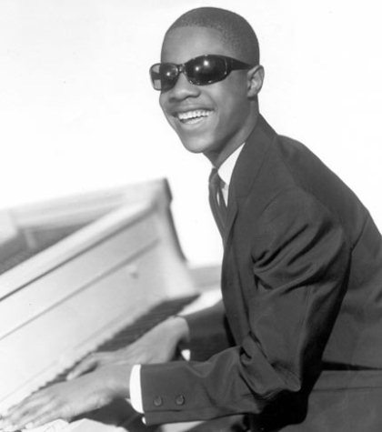 Photo of a young Stevie Wonder playing the piano