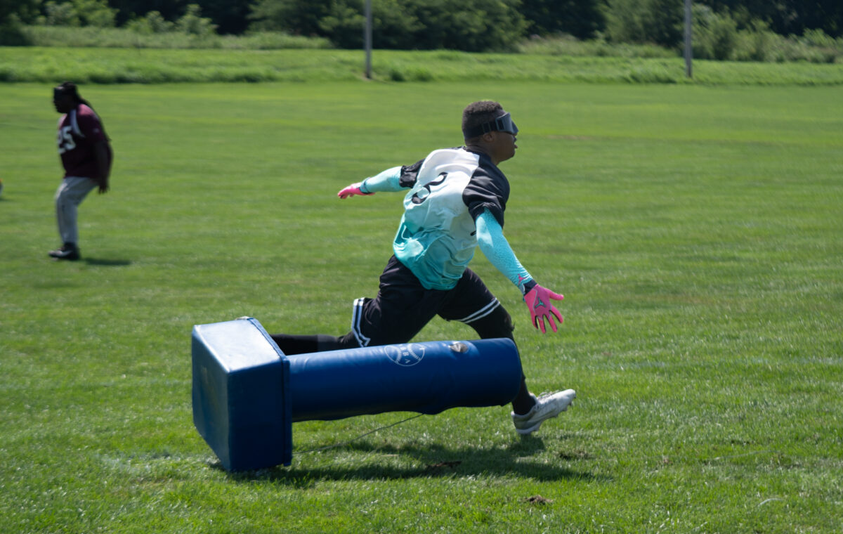 Z beep Ball player hitting a base